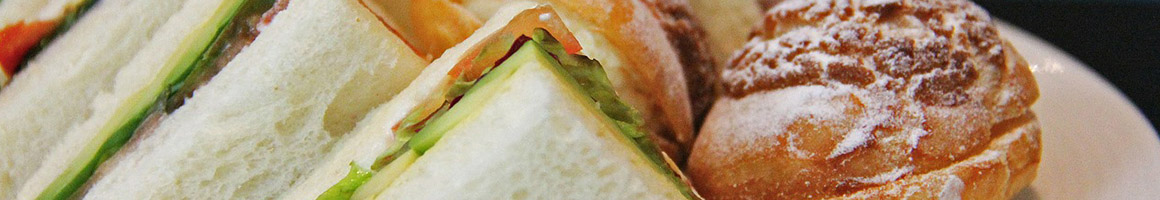 Eating Deli Sandwich at Cricca's Italian Deli restaurant in Woodland Hills, CA.